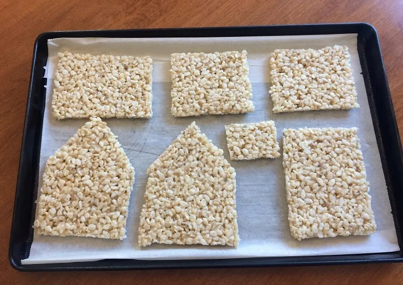 rice krispies cake cut into house pieces